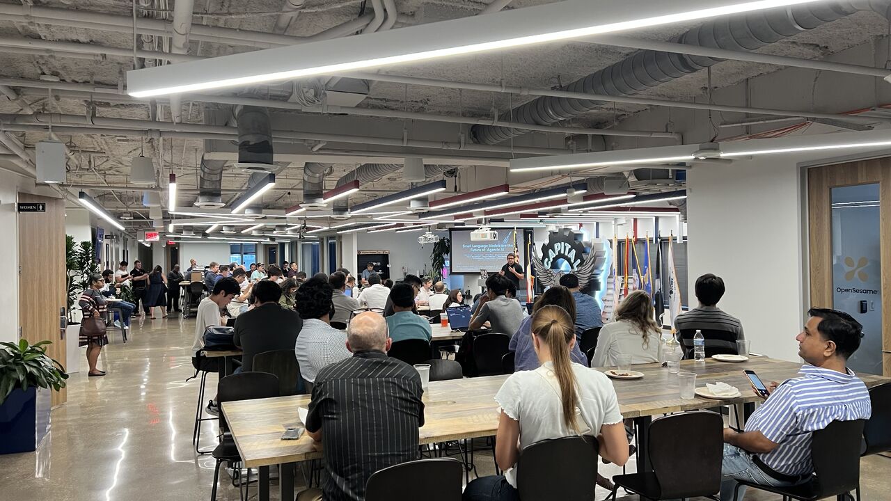 Attendees gathered for a talk at the AICamp Austin meetup.